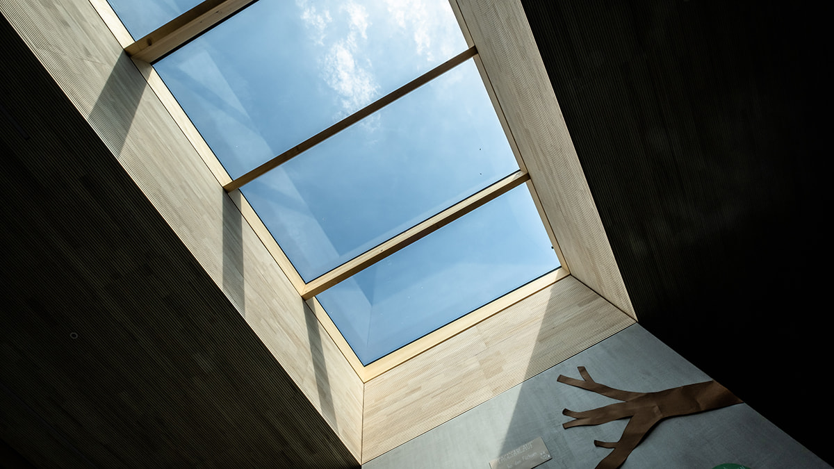 LAMILUX glass roof PR60 allows a view to the sky above the building