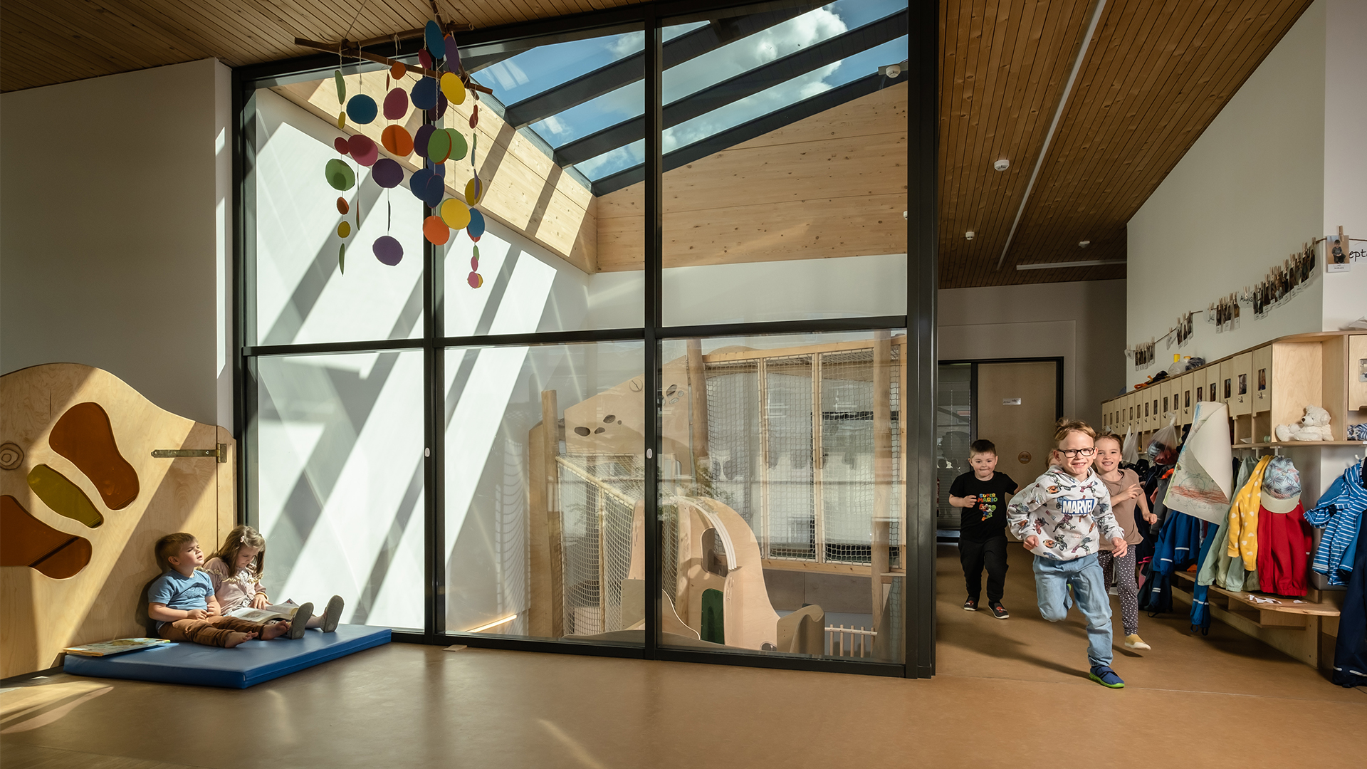 Kita Emilio featuring a bright play area and glass roof providing natural daylight